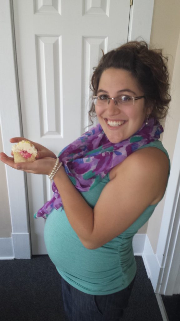 We shared the news with pink-icing filled cupcakes!